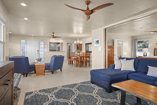 living room featuring light tile patterned floors and a chandelier