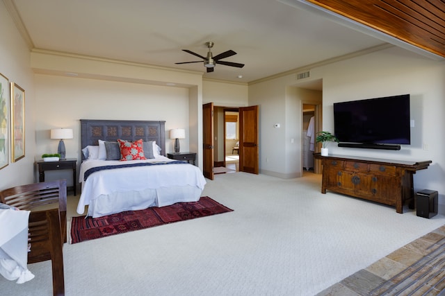 bedroom with ceiling fan, light carpet, and ornamental molding