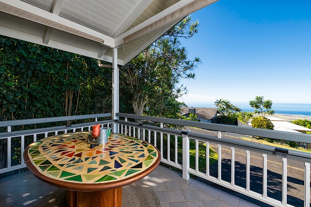 balcony featuring a water view