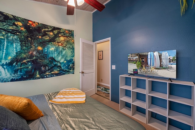 carpeted bedroom featuring ceiling fan and wooden ceiling