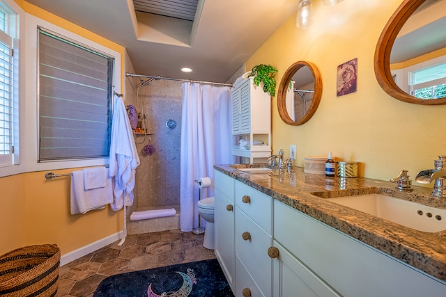 bathroom with a shower with curtain, toilet, and a healthy amount of sunlight