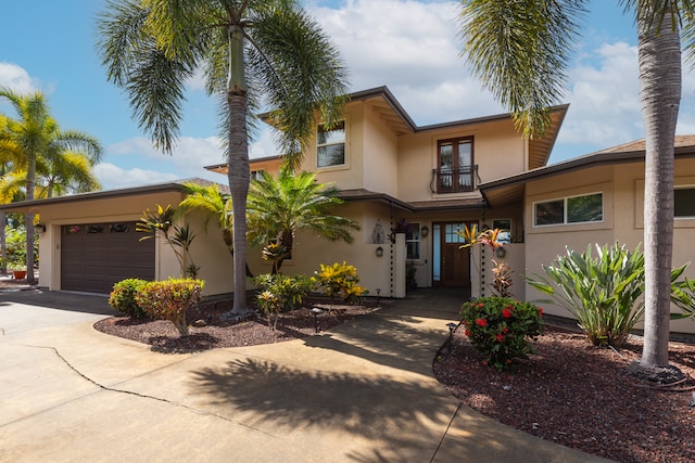 view of front of home featuring a balcony