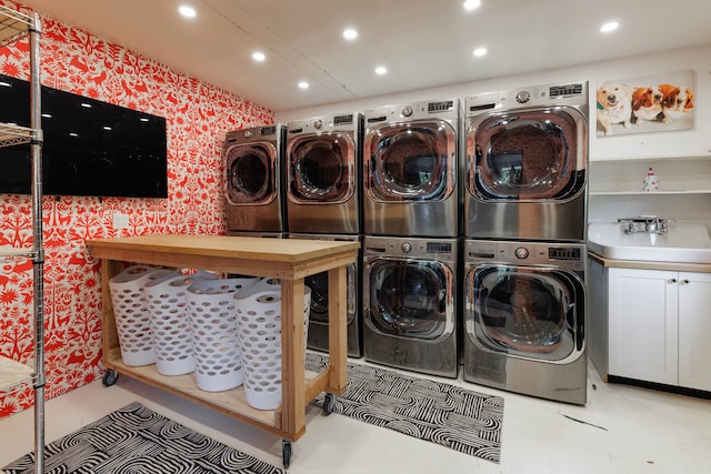 laundry room featuring cabinets, sink, independent washer and dryer, and stacked washer / dryer