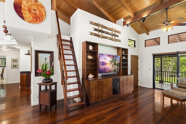 living room with ceiling fan, beamed ceiling, high vaulted ceiling, dark hardwood / wood-style floors, and wood ceiling