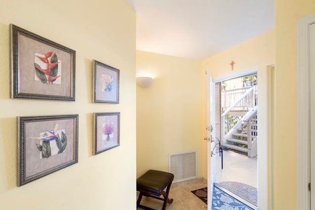 doorway with light tile patterned floors