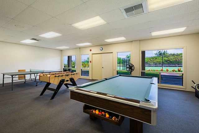 recreation room featuring a paneled ceiling, dark carpet, and billiards