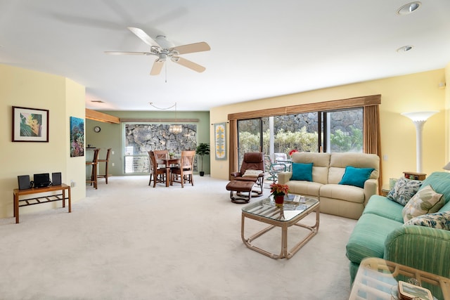 living room featuring light carpet and ceiling fan