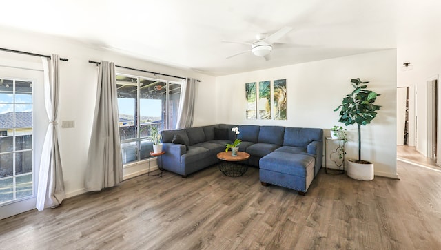 living room with hardwood / wood-style flooring, a wealth of natural light, and ceiling fan