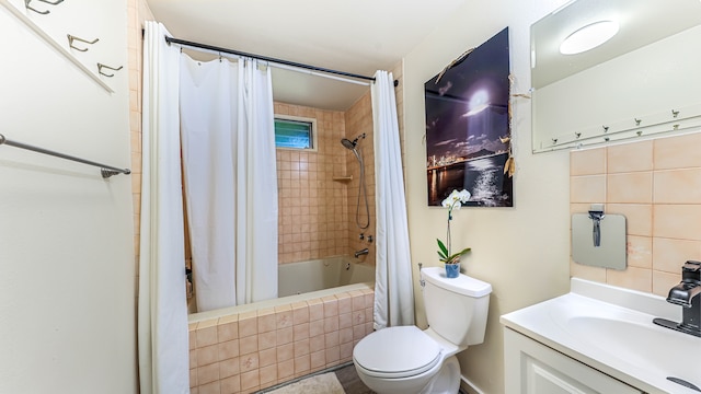 full bathroom featuring vanity, toilet, and shower / bath combo with shower curtain