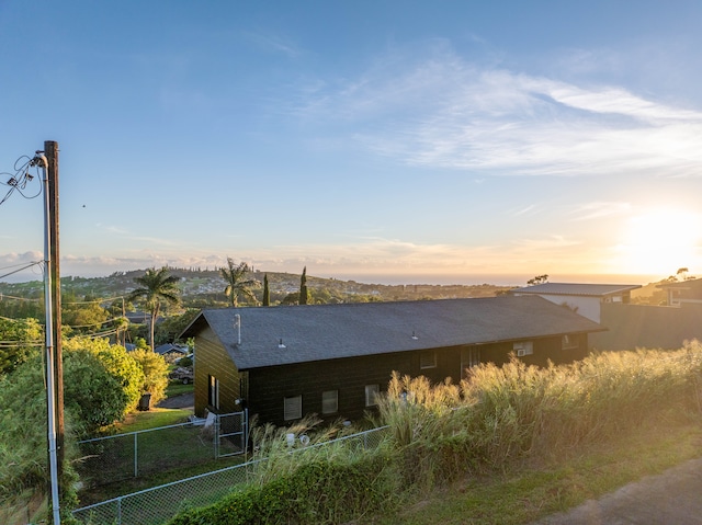 view of back house at dusk