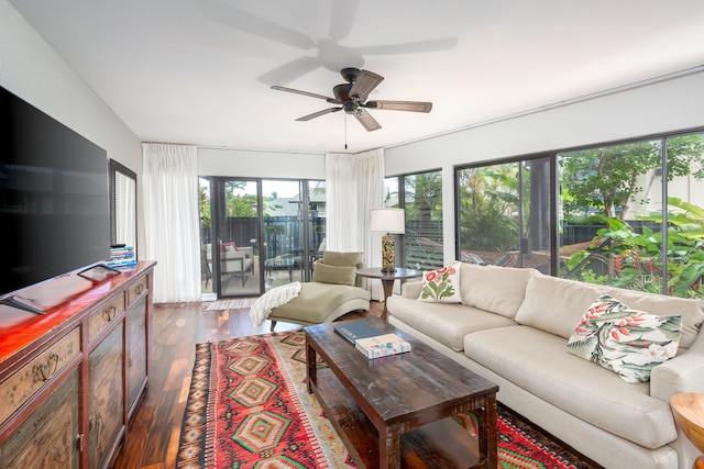 living room with ceiling fan, dark hardwood / wood-style flooring, and a healthy amount of sunlight