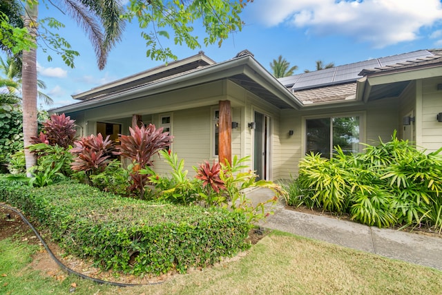 view of front of home featuring solar panels