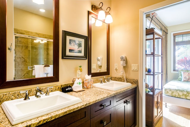 bathroom with vanity and an enclosed shower