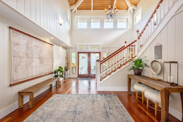 foyer entrance featuring french doors, high vaulted ceiling, a wealth of natural light, and wood ceiling