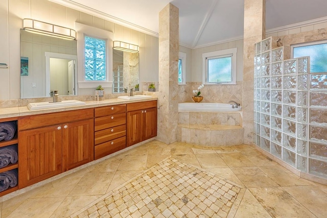 bathroom with vanity, a relaxing tiled tub, crown molding, and tile walls