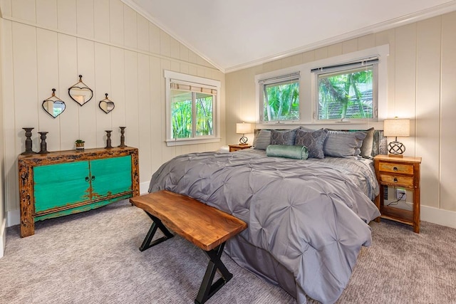 bedroom with multiple windows, crown molding, light colored carpet, and vaulted ceiling