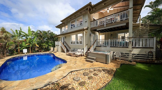 view of pool featuring ceiling fan and a patio area