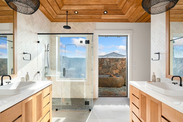 bathroom featuring tile patterned flooring, a shower with door, wood ceiling, and a tray ceiling