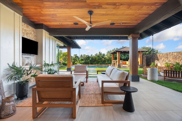 view of patio / terrace with a gazebo, an outdoor living space, and ceiling fan