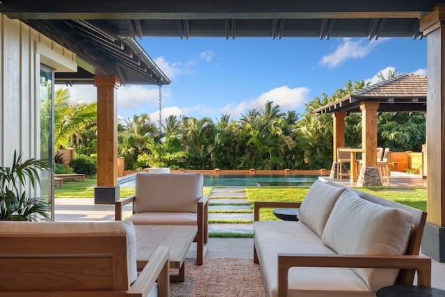 view of patio / terrace with outdoor lounge area and a swimming pool