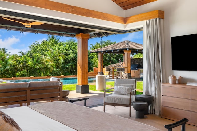 bedroom with lofted ceiling and multiple windows