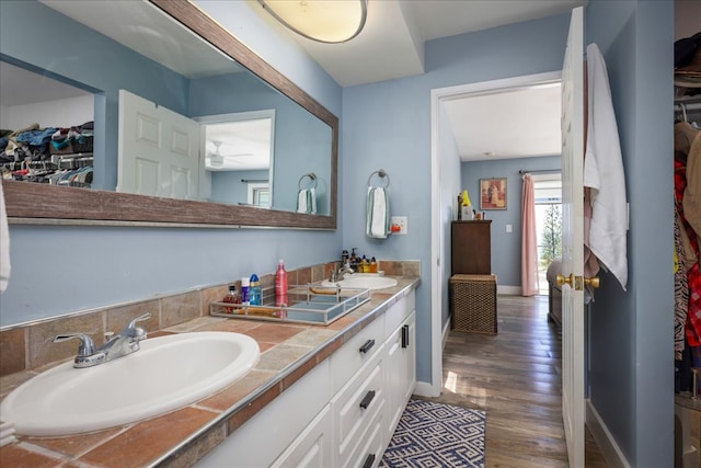 bathroom featuring vanity and hardwood / wood-style flooring