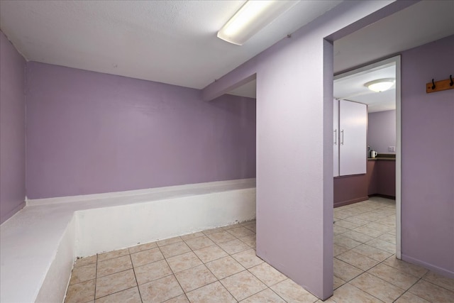 basement with light tile patterned floors