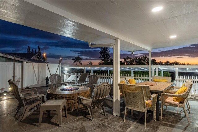 patio terrace at dusk with an outdoor fire pit