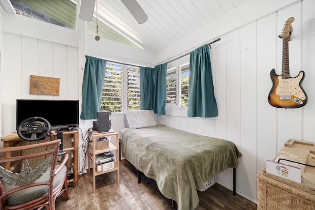 bedroom with dark hardwood / wood-style floors, vaulted ceiling, and ceiling fan