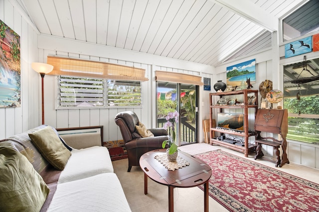 sunroom featuring lofted ceiling with beams and wooden ceiling