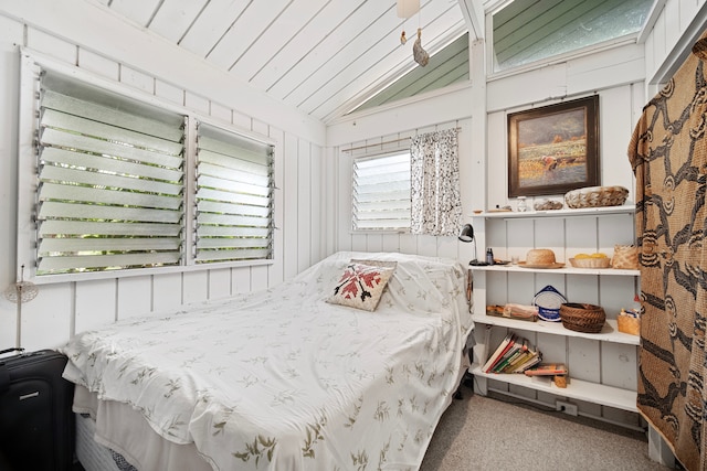 bedroom featuring carpet flooring and lofted ceiling