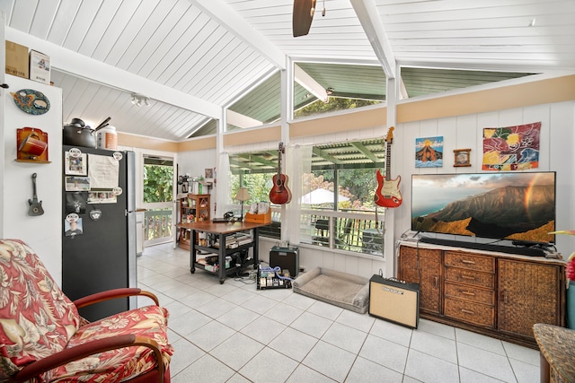 sunroom / solarium with lofted ceiling with beams and ceiling fan