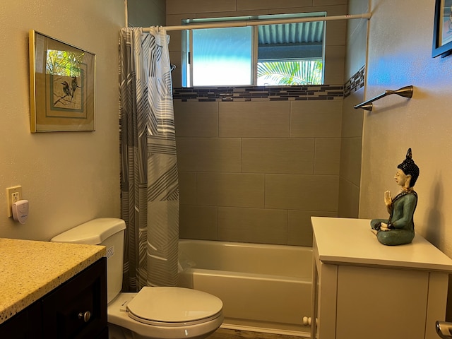 full bathroom with vanity, toilet, and shower / bath combo with shower curtain