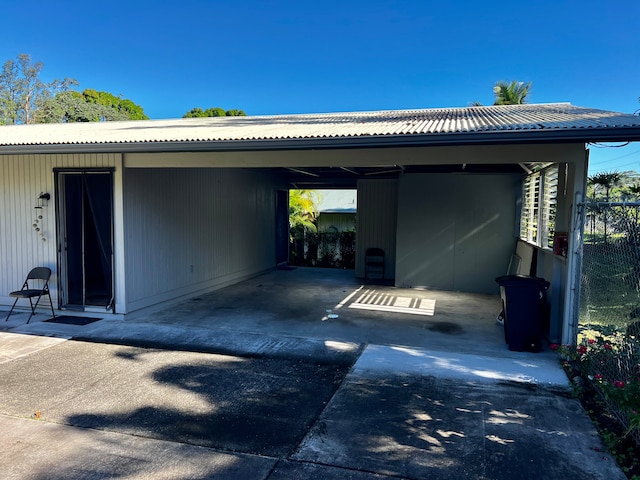 view of parking / parking lot featuring a carport