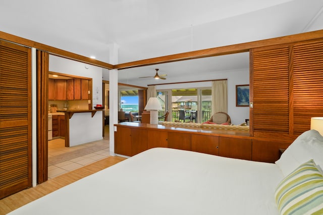 bedroom with light wood-type flooring and access to outside