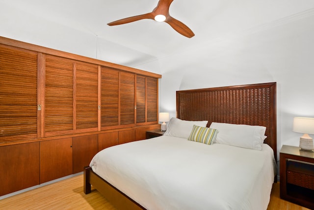 bedroom featuring light hardwood / wood-style floors and ceiling fan