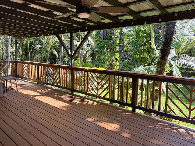 wooden deck featuring ceiling fan