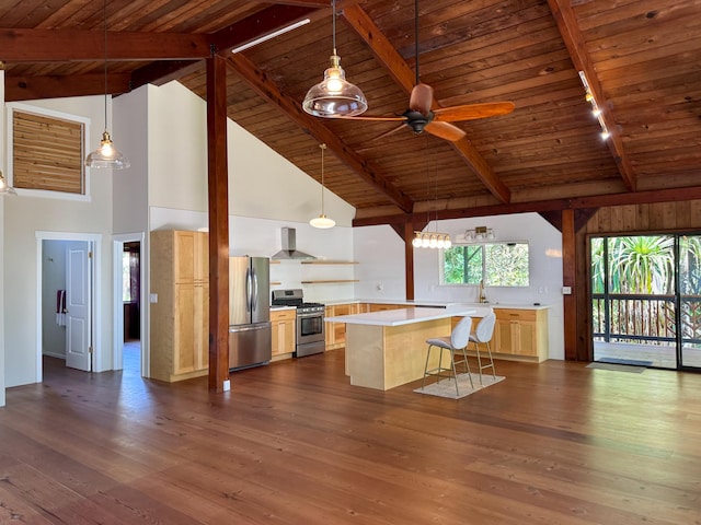 kitchen featuring a center island, dark wood-type flooring, stainless steel appliances, a kitchen bar, and wood ceiling