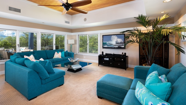 carpeted living room with ceiling fan, wooden ceiling, a wealth of natural light, and french doors