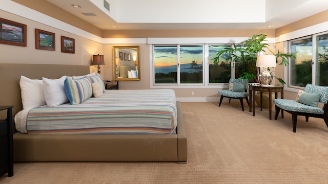 bedroom featuring light carpet