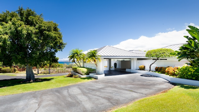 view of front of home with a carport