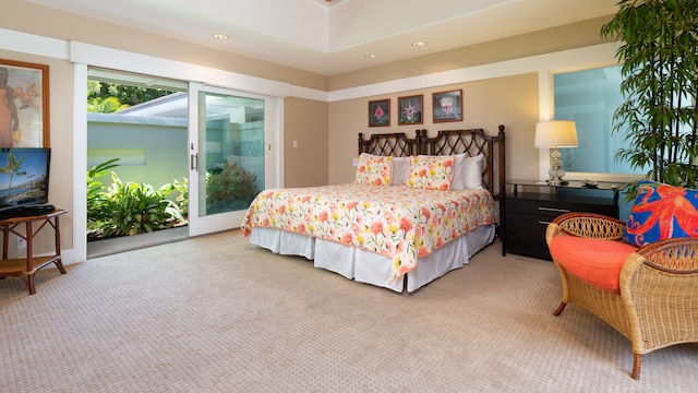 carpeted bedroom with access to exterior