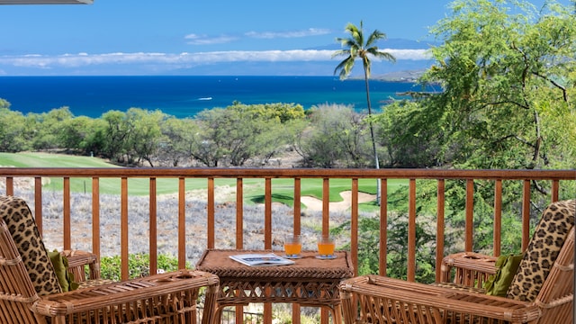 balcony featuring a water view