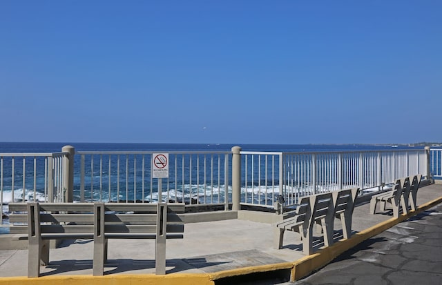 exterior space featuring a view of the beach and a water view