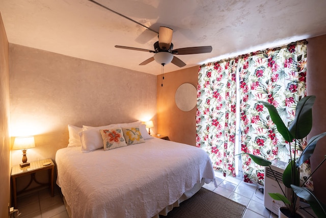 bedroom featuring ceiling fan and light tile patterned floors