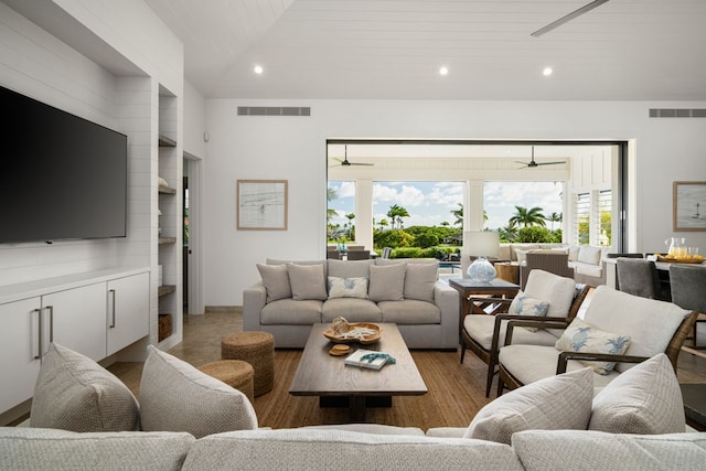 living room featuring ceiling fan and a healthy amount of sunlight