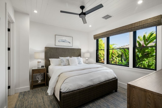 bedroom with ceiling fan and wooden ceiling