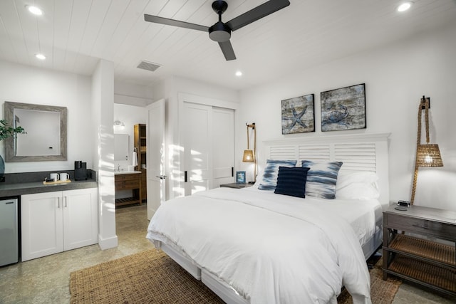 bedroom with wooden ceiling, a closet, ceiling fan, and ensuite bathroom