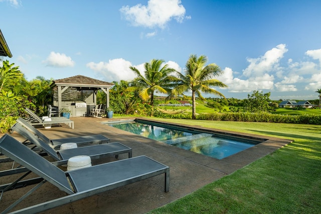 view of pool with exterior bar, a yard, and a patio area