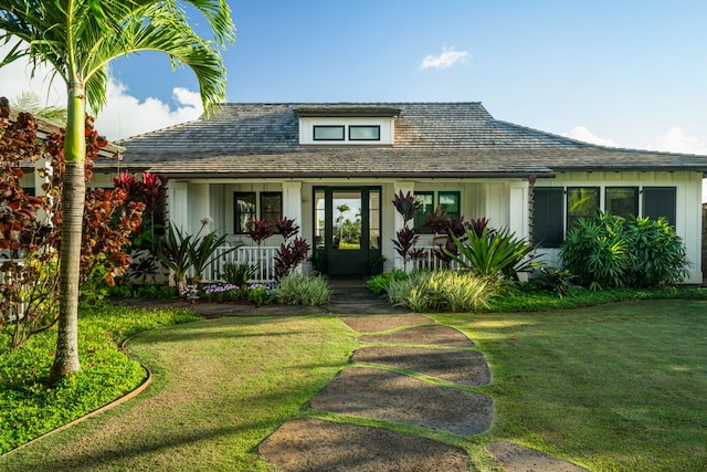 bungalow-style home with a porch and a front yard